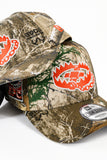 SFC X NEW ERA "TRAP'N" 9FORTY A-FRAME SNAPBACK (REAL TREE CAMO / ORANGE)