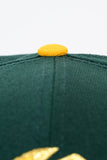 NEW ERA "U OF OAKLAND" OAKLAND OAKS FITTED HAT (DARK GREEN/YELLOW)