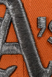 NEW ERA "GETTIN IT” OAKLAND ATHLETICS FITTED HAT (BURNT ORANGE/BLACK/CHROME)