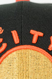 NEW ERA "CITY NIGHTS” SAN FRANCISCO WARRIORS FITTED HAT (BLACK/ORANGE)