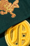 NEW ERA "U OF OAKLAND" OAKLAND OAKS FITTED HAT (DARK GREEN/YELLOW)