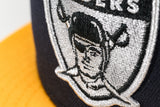 NEW ERA “MEMORIAL STADIUM” LAS VEGAS RAIDERS FITTED HAT (NAVY/A GOLD/GREY)