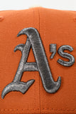 NEW ERA "GETTIN IT” OAKLAND ATHLETICS FITTED HAT (BURNT ORANGE/BLACK/CHROME)