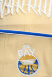 NEW ERA "STRENGTH IN NUMBERS” GOLDEN STATE WARRIORS  FITTED HAT (VEGAS GOLD/ROYAL)