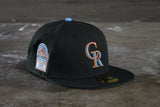 NEW ERA "ICE ROAD" COLORADO ROCKIES FITTED HAT (BLACK/ SONGBIRD BLUE)