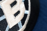 NEW ERA "BULLSEYE" BOSTON BRUINS FITTED HAT (BLACK/OCEANSIDE BLUE/SKY BLUE)
