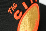 NEW ERA "CITY NIGHTS” SAN FRANCISCO WARRIORS FITTED HAT (BLACK/ORANGE)