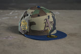 NEW ERA “CAMO" OAKLAND ATHLETICS FITTED HAT (WOODLAND/OCEANSIDE BLUE)