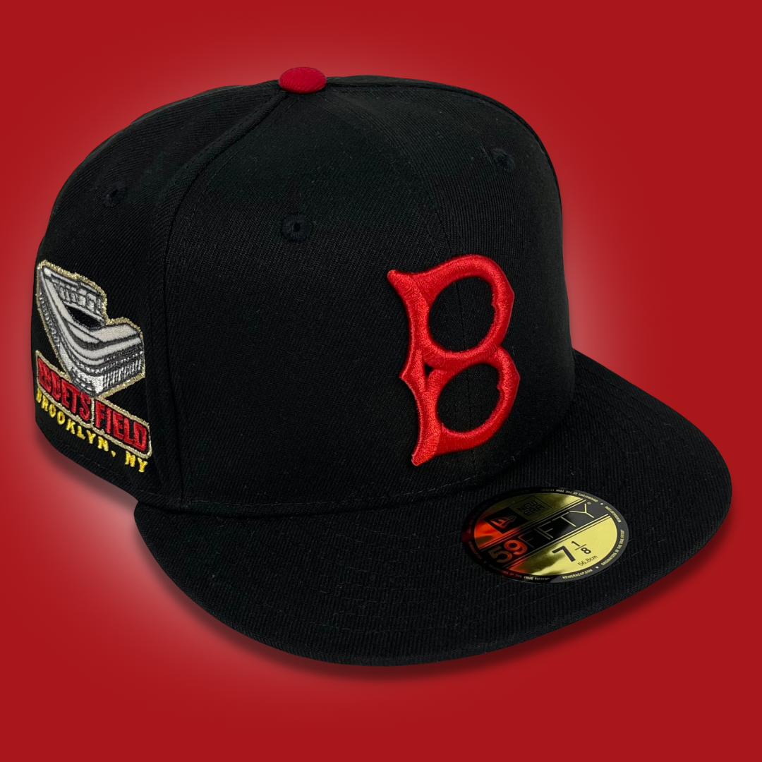 black and red fitted hat with patch